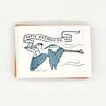 Letterpress card with a great blue heron carrying a birthday banner