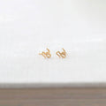 Kris Nations snake stud earrings in 18k gold vermeil