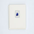 Letterpress card with a postage stamp illustration of a blue USPS mailbox