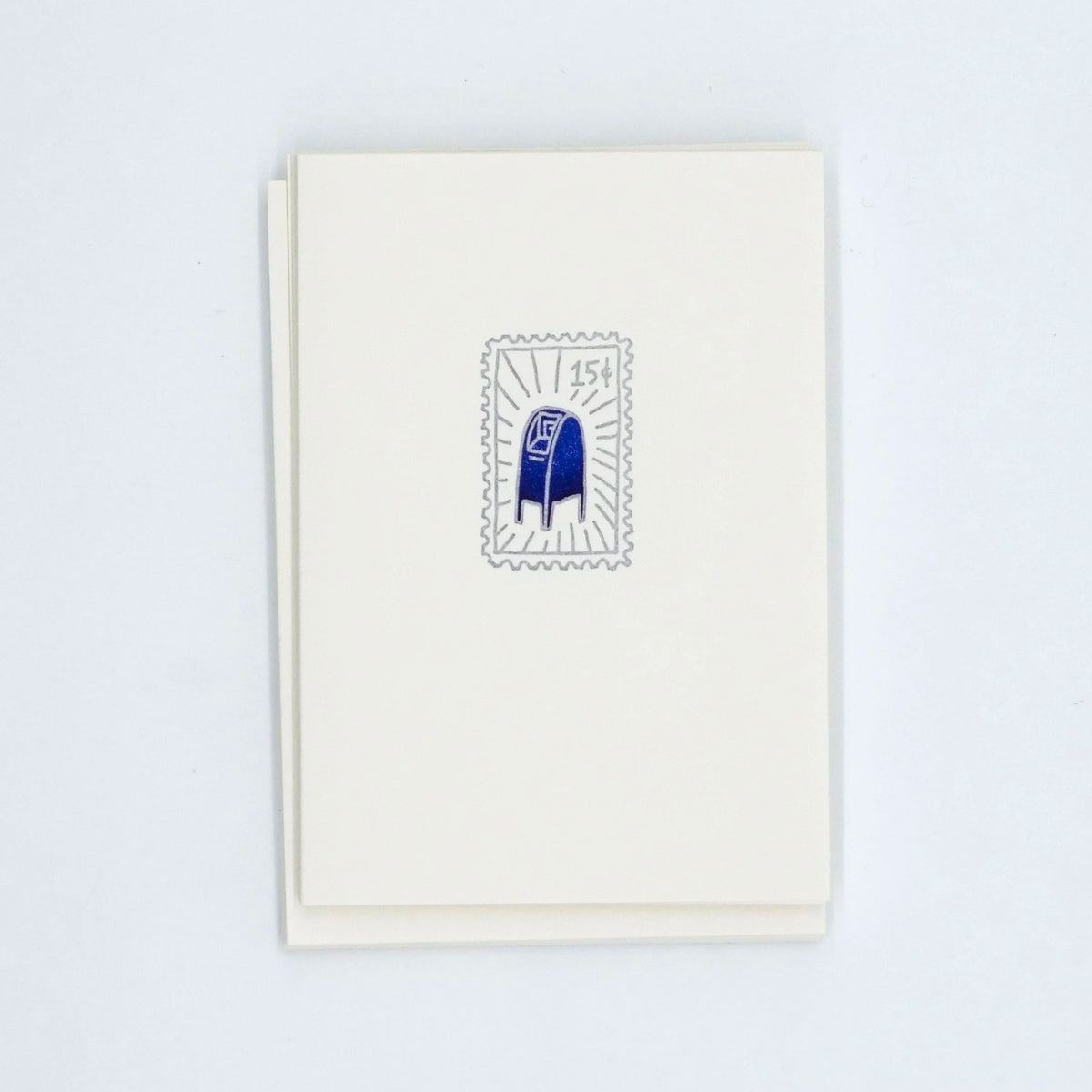 Letterpress card with a postage stamp illustration of a blue USPS mailbox